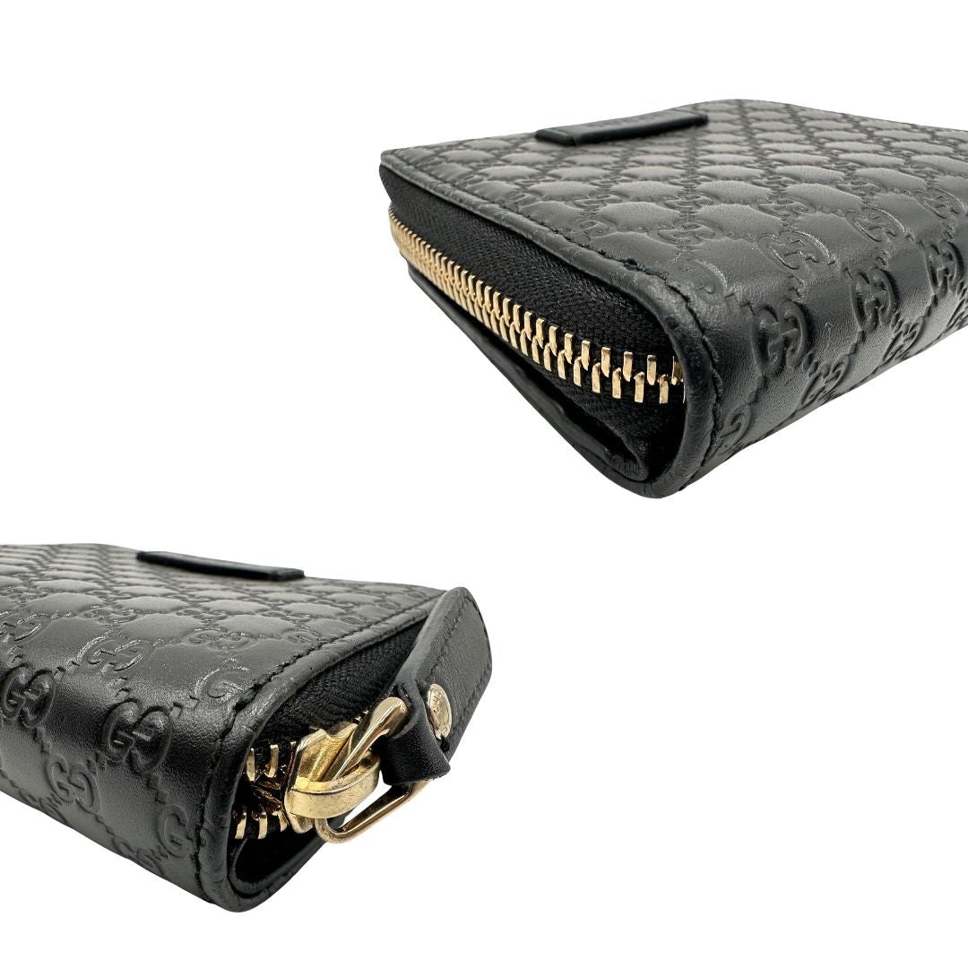 Angoli di un Portafoglio Gucci in pelle nera GG con parti metalliche dorate. Completo di scatola. Originale, usato, di lusso, in ottime condizioni.