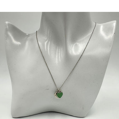 Collana Tiffany&Co. della collezione Return To Tiffany in argento 925 con doppio ciondolo cuore. Completa di scatola e sacchetto.