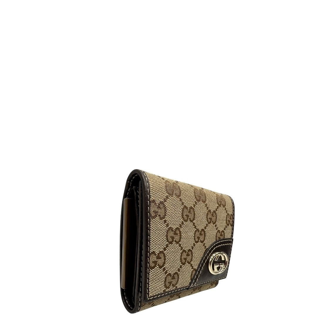 lato Portafoglio Gucci in tessuto beige GG con finiture in pelle marrone e parti metalliche dorate. Completo di busta e dustbag, di lusso, originale, ottime condizioni. 