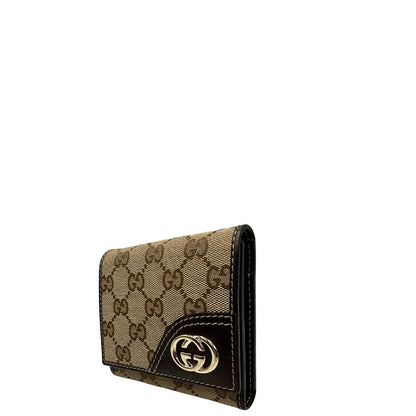 lato Portafoglio Gucci in tessuto beige GG con finiture in pelle marrone e parti metalliche dorate. Completo di busta e dustbag, di lusso, originale, ottime condizioni. 