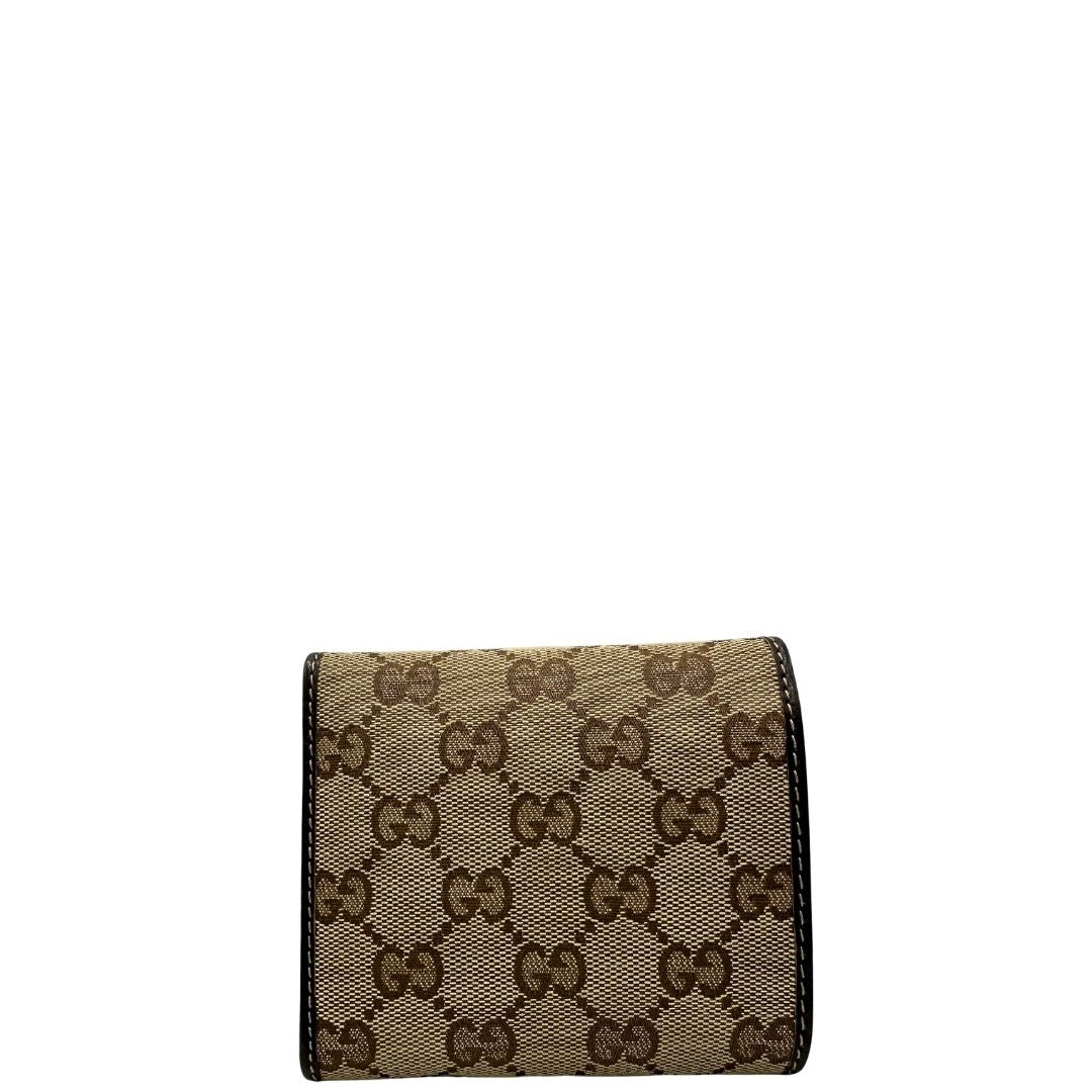 retro Portafoglio Gucci in tessuto beige GG con finiture in pelle marrone e parti metalliche dorate. Completo di busta e dustbag, di lusso, originale, ottime condizioni. 