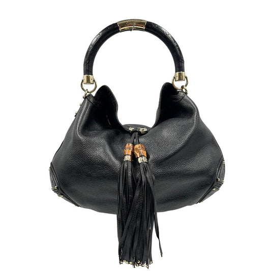 front Borsa Gucci in pelle nera con parti metalliche dorate; munita di un manico rigido e impreziosita da doppia nappa con dettaglio bamboo, di lusso, originale, ottime condizioni. 