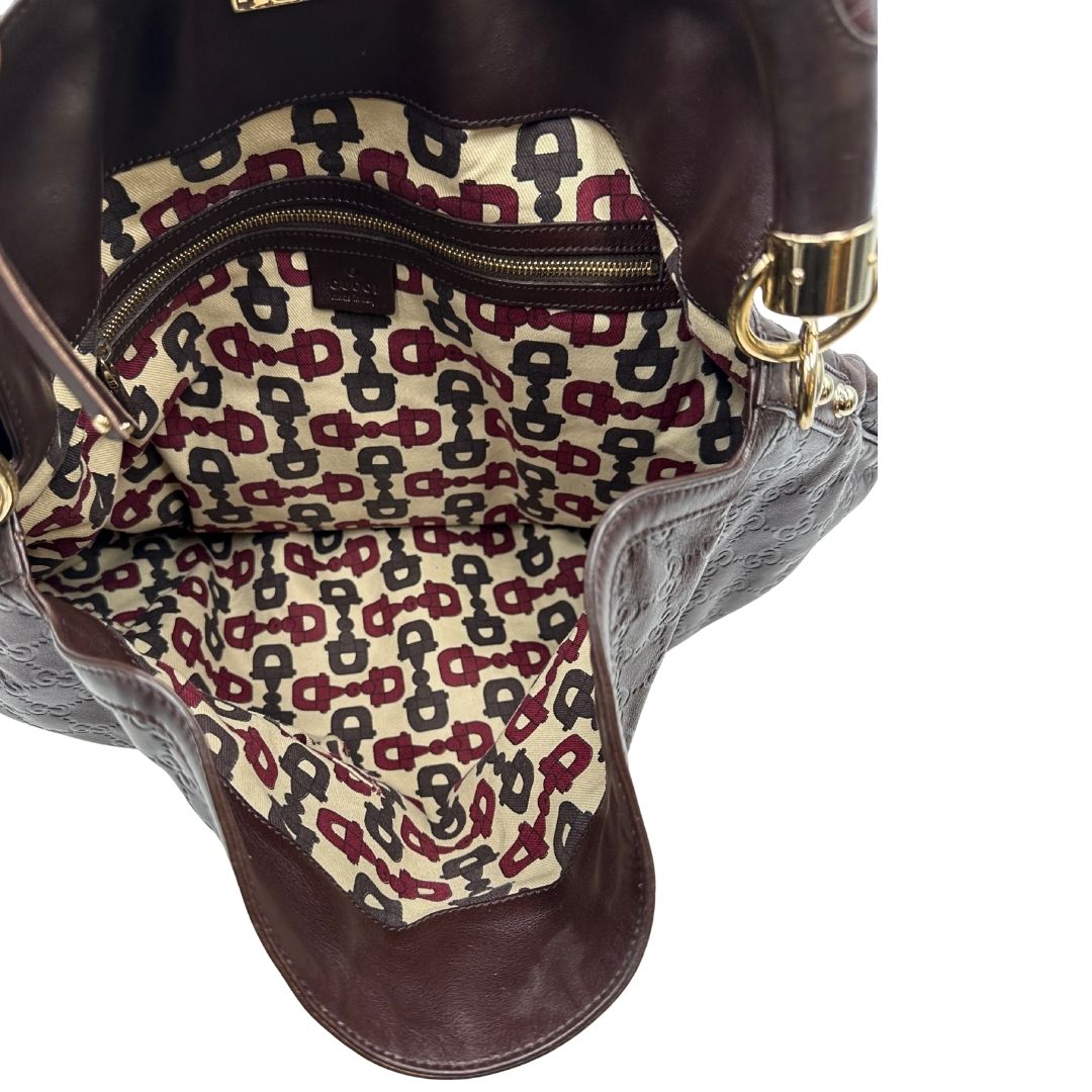 interno Borsa Gucci in pelle marrone GG con parti metalliche dorate; munita di un manico rigido, impreziosita da doppia nappa con dettaglio bamboo e angoli finiture metalliche, di lusso, originale, ottime condizioni 