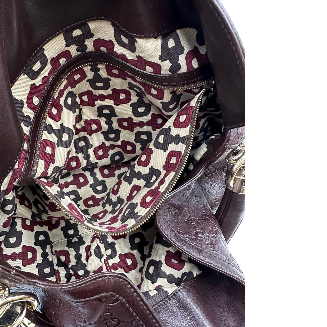 interno Borsa Gucci in pelle marrone GG con parti metalliche dorate; munita di un manico rigido, impreziosita da doppia nappa con dettaglio bamboo e angoli finiture metalliche, di lusso, originale, ottime condizioni 