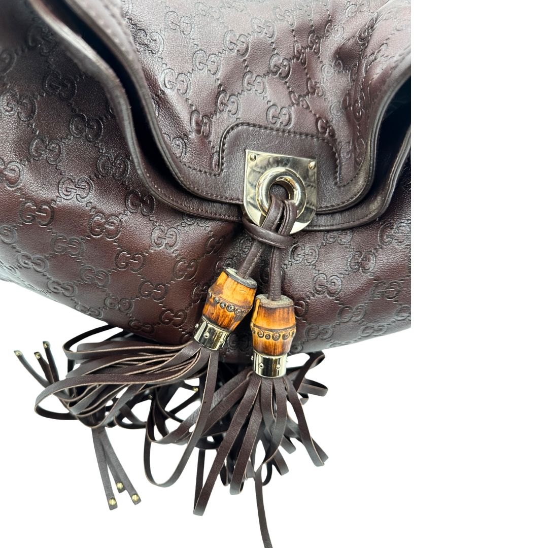 bamboo dettaglio Borsa Gucci in pelle marrone GG con parti metalliche dorate; munita di un manico rigido, impreziosita da doppia nappa con dettaglio bamboo e angoli finiture metalliche, di lusso, originale, ottime condizioni 