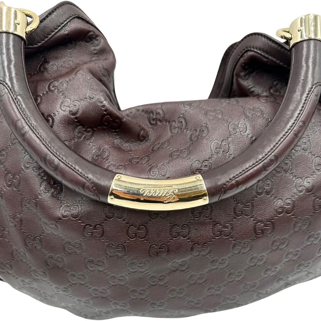 manico Borsa Gucci in pelle marrone GG con parti metalliche dorate; munita di un manico rigido, impreziosita da doppia nappa con dettaglio bamboo e angoli finiture metalliche, di lusso, originale, ottime condizioni 