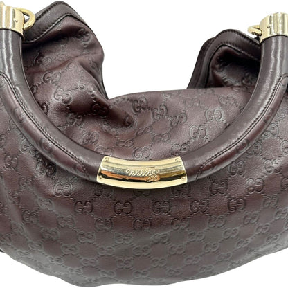 manico Borsa Gucci in pelle marrone GG con parti metalliche dorate; munita di un manico rigido, impreziosita da doppia nappa con dettaglio bamboo e angoli finiture metalliche, di lusso, originale, ottime condizioni 