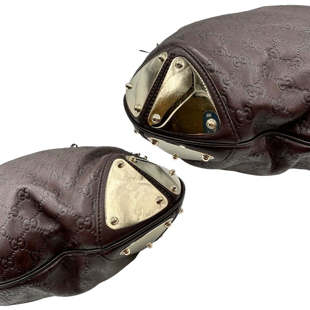 angoli Borsa Gucci in pelle marrone GG con parti metalliche dorate; munita di un manico rigido, impreziosita da doppia nappa con dettaglio bamboo e angoli finiture metalliche, di lusso, originale, ottime condizioni 