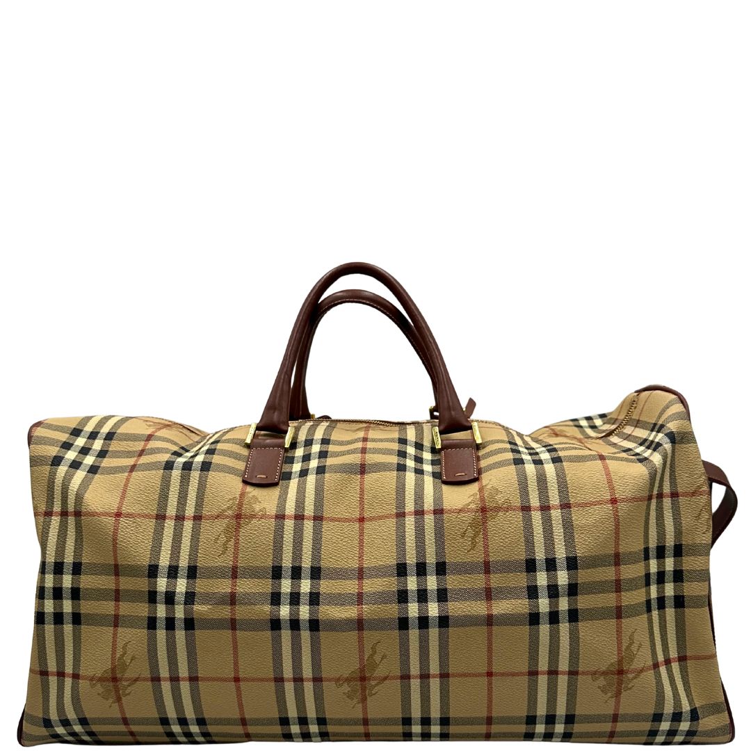 retro Borsone Burberry in canvas trama tartan con finiture in pelle marroni e parti metalliche dorate; munito di doppi manici stondati e una tracolla amovibile. Completo di lucchetto e chiavi, di lusso, originale, ottime condizioni. 