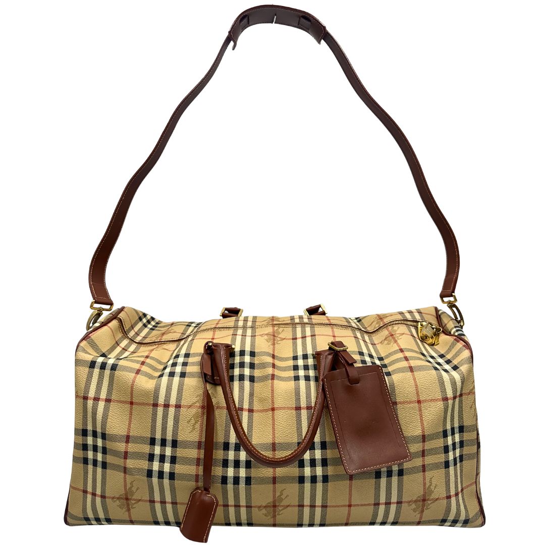 front Borsone Burberry in canvas trama tartan con finiture in pelle marroni e parti metalliche dorate; munito di doppi manici stondati e una tracolla amovibile. Completo di lucchetto e chiavi, di lusso, originale, ottime condizioni. 