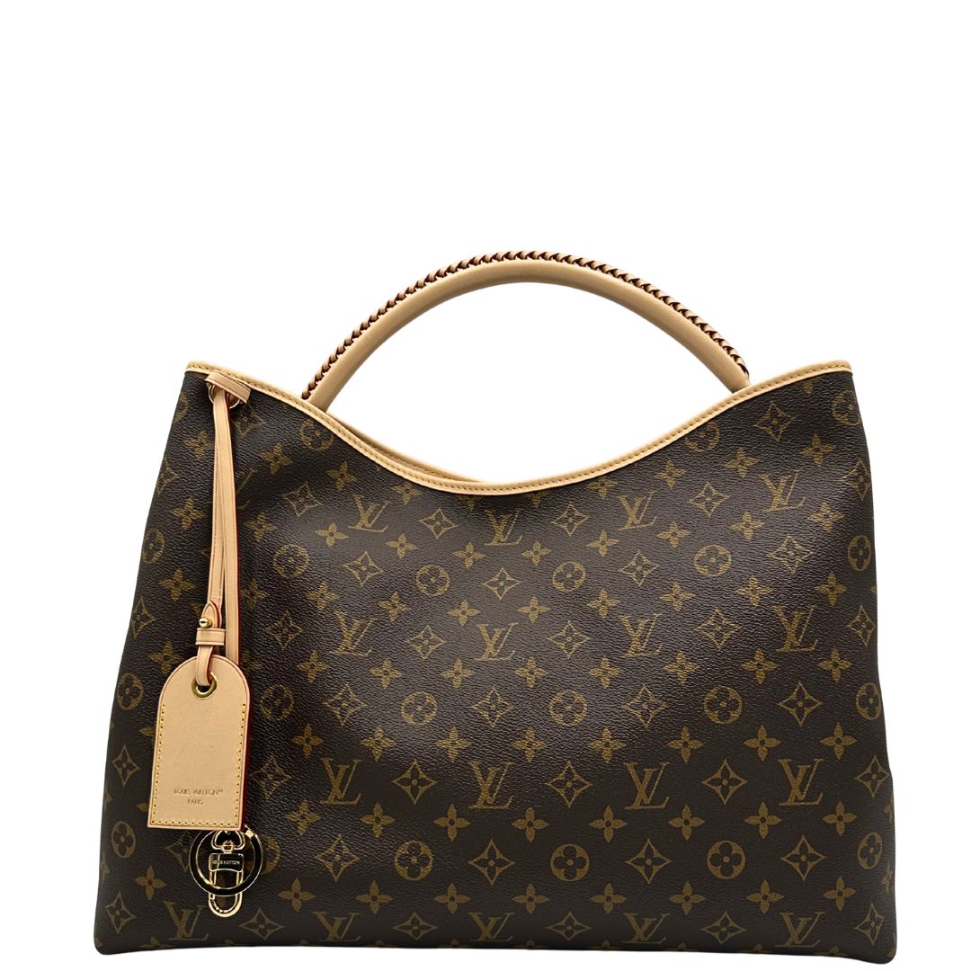 front Borsa L.V. in canvas marrone monogram con finiture in vacchetta naturale e parti metalliche dorate; munita di un manico singolo stondato e intrecciato, indossabile a spalla. Completa di corredo, di lusso, originale, ottime condizioni. 