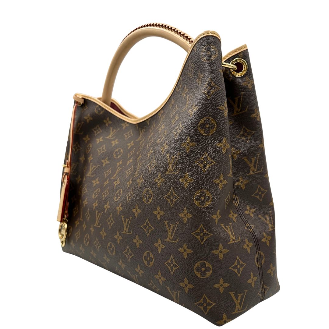 lato Borsa L.V. in canvas marrone monogram con finiture in vacchetta naturale e parti metalliche dorate; munita di un manico singolo stondato e intrecciato, indossabile a spalla. Completa di corredo, di lusso, originale, ottime condizioni. 