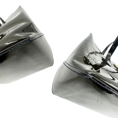 angoli Borsa Louis Vuitton in pelle verniciata marrone con riflessi che tendono al verde e parti metalliche dorate; munita di doppi manici, da portare a mano. Completa di corredo, di lusso, originale, ottime condizioni, usata.