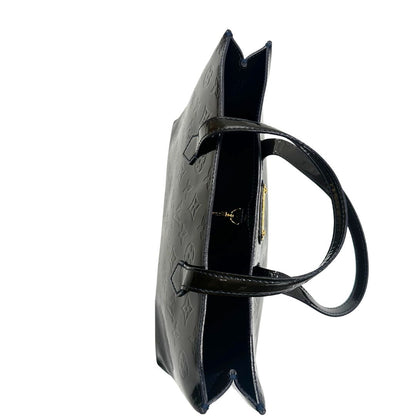 gancio chiusura della Borsa Louis Vuitton in pelle verniciata marrone con riflessi che tendono al verde e parti metalliche dorate; munita di doppi manici, da portare a mano. Completa di corredo, di lusso, originale, ottime condizioni, usata. 