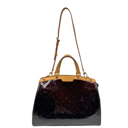 front Borsa Louis Vuitton in pelle verniciata monogram color amaranto con parti metalliche dorate, rifinita in vacchetta naturale; munita di doppi manici e un manico amovibile e regolabile. Completa di dustbag, di lusso, originale, ottime condizioni, usata. 