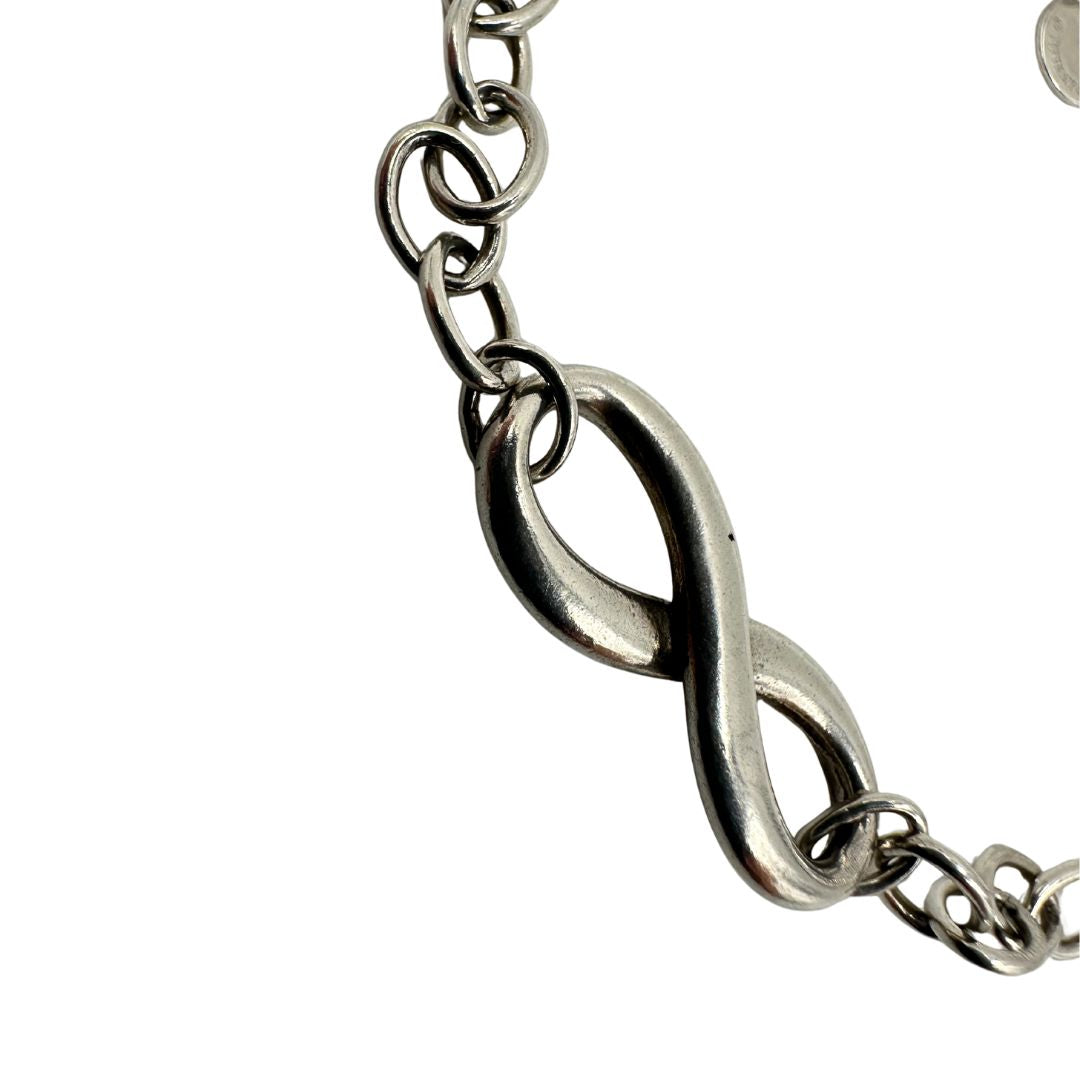  Bracciale Tiffany&Co. in argento 925 con ciondolo "infinito'' Completo di sacchetto antipolvere e scatola, originale, usato, di lusso.