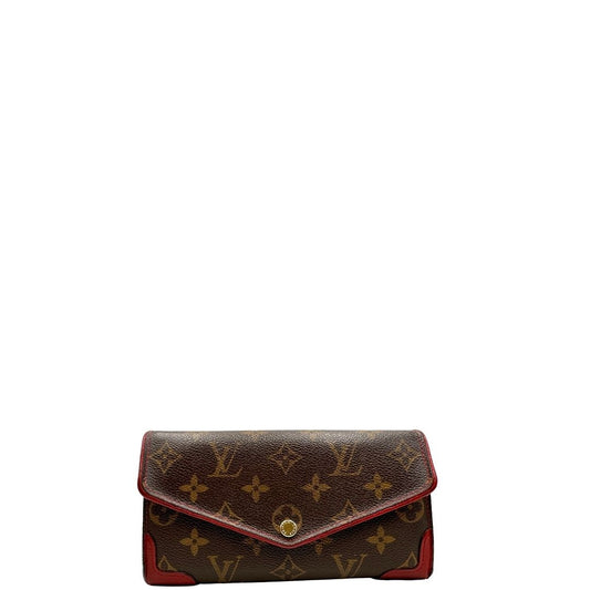 Portafoglio Louis Vuitton Sarah Retiro in canvas monogrammato marrone e finiture rosse, completo di corredo.