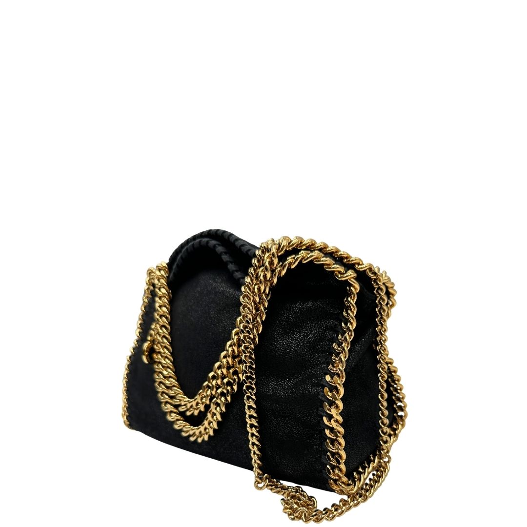 lato Borsa Stella McCartney Falabella in tessuto vegano nero con parti metalliche dorate. Completa di dustbag e scatola, di lusso, originale, eccellenti condizioni, usata. 