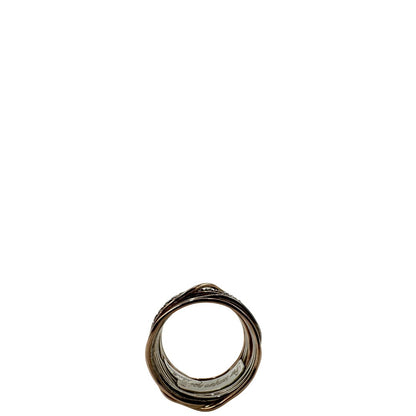 Tredici fili in oro rosa 9kt e argento 925 arricchito al palladio intrecciati, sulla cui superficie risplendono sedici diamanti bianchi taglio brillante da 0.21 ct. Completo di scatola, di lusso, originale, ottime condizioni, usato.