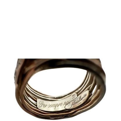 Tredici fili in oro rosa 9kt e argento 925 arricchito al palladio intrecciati, sulla cui superficie risplendono sedici diamanti bianchi taglio brillante da 0.21 ct. Completo di scatola, di lusso, originale, ottime condizioni, usato.