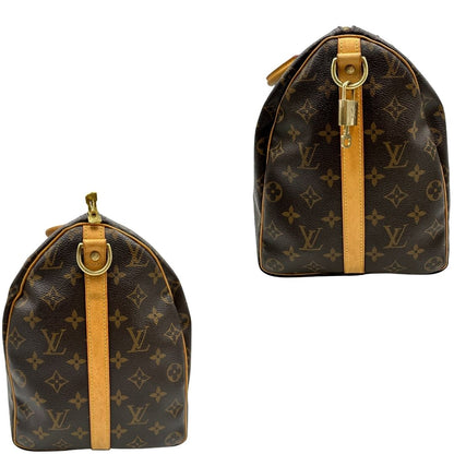 lati Borsa Louis Vuitton in canvas marrone monogram con finiture in vacchetta naturale e parti metalliche dorate; munita di doppi manici stondati. Completa di lucchetto e chiavi, di lusso, originale, ottime condizioni, usato. 