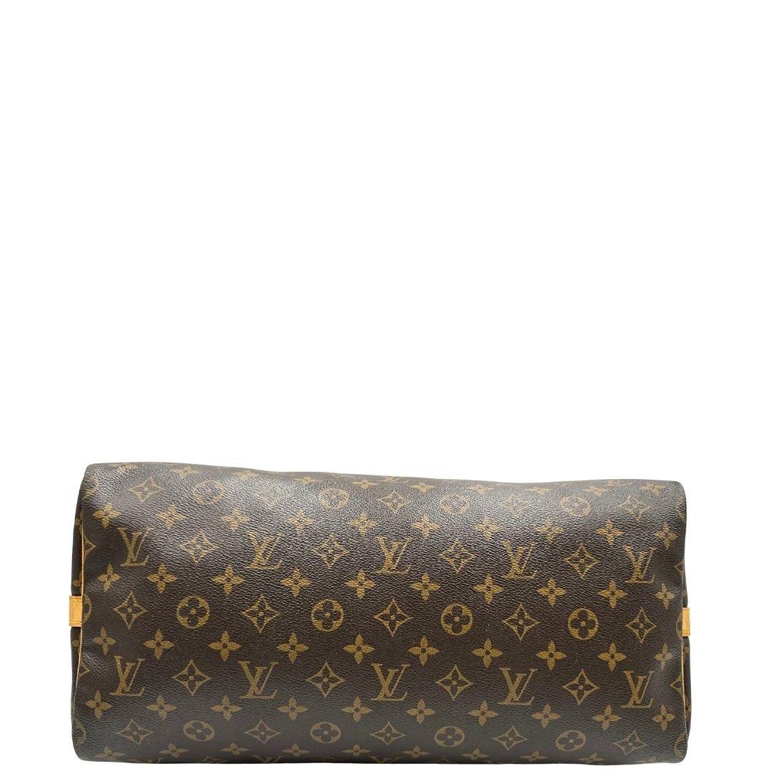 base Borsa Louis Vuitton in canvas marrone monogram con finiture in vacchetta naturale e parti metalliche dorate; munita di doppi manici stondati. Completa di lucchetto e chiavi, di lusso, originale, ottime condizioni, usato. 