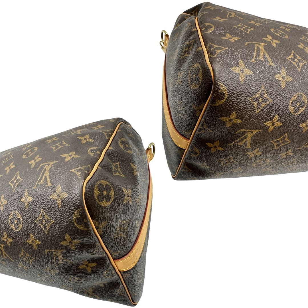 angoli Borsa Louis Vuitton in canvas marrone monogram con finiture in vacchetta naturale e parti metalliche dorate; munita di doppi manici stondati. Completa di lucchetto e chiavi, di lusso, originale, ottime condizioni, usato. 