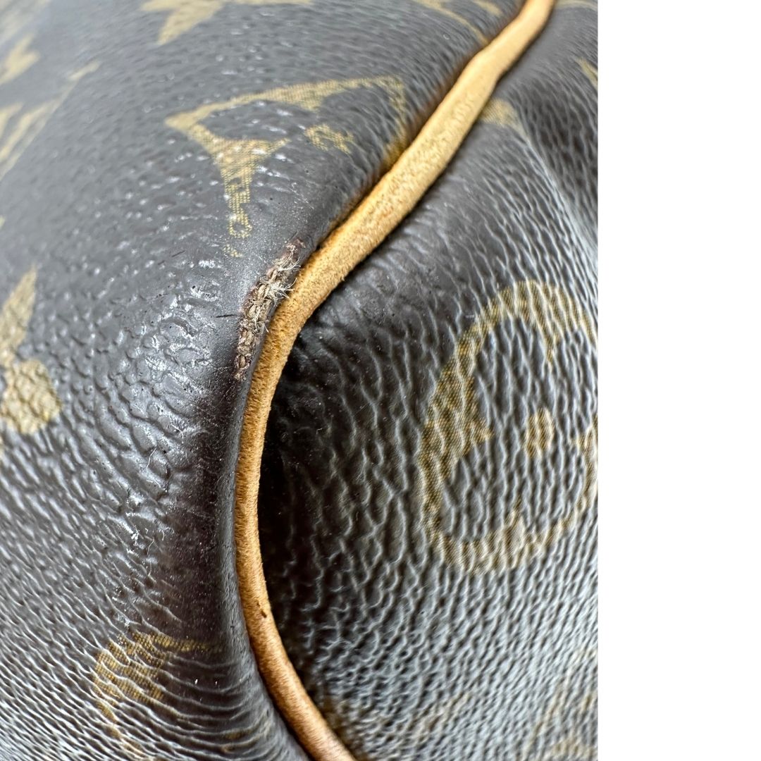 angolo Borsa Louis Vuitton in canvas marrone monogram con finiture in vacchetta naturale e parti metalliche dorate; munita di doppi manici stondati. Completa di lucchetto e chiavi, di lusso, originale, ottime condizioni, usato. 