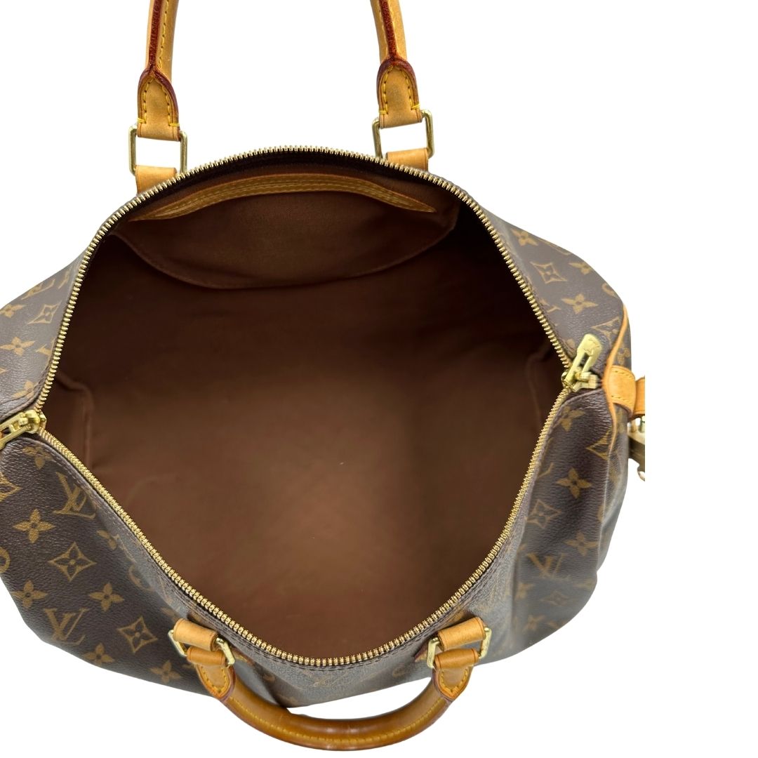 interno Borsa Louis Vuitton in canvas marrone monogram con finiture in vacchetta naturale e parti metalliche dorate; munita di doppi manici stondati. Completa di lucchetto e chiavi, di lusso, originale, ottime condizioni, usato. 