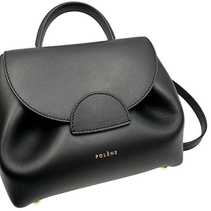  Borsa Polène in pelle nera con parti metalliche dorate; munita di un manico singolo stondato e una tracolla regolabile. Full set, di lusso, originale, ottime condizioni, usata.  