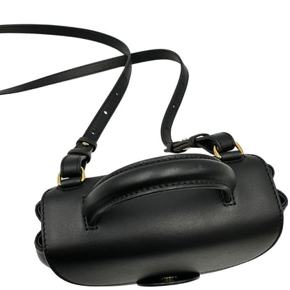 mancio  Borsa Polène in pelle nera con parti metalliche dorate; munita di un manico singolo stondato e una tracolla regolabile. Full set, di lusso, originale, ottime condizioni, usata.  