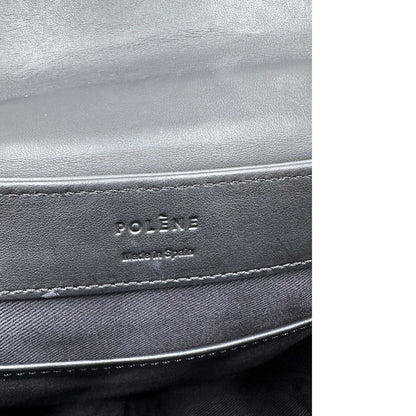 interni  Borsa Polène in pelle nera con parti metalliche dorate; munita di un manico singolo stondato e una tracolla regolabile. Full set, di lusso, originale, ottime condizioni, usata.  