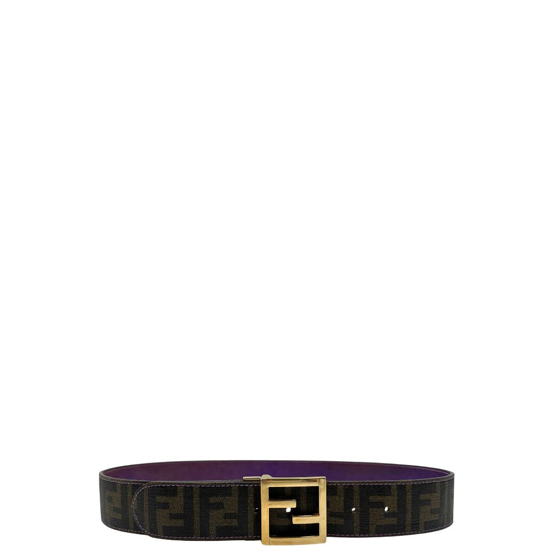Cintura Fendi reversibile in canvas color tabacco con trama zucca e in pelle viola. Originale, usata, di lusso, in ottime condizioni.