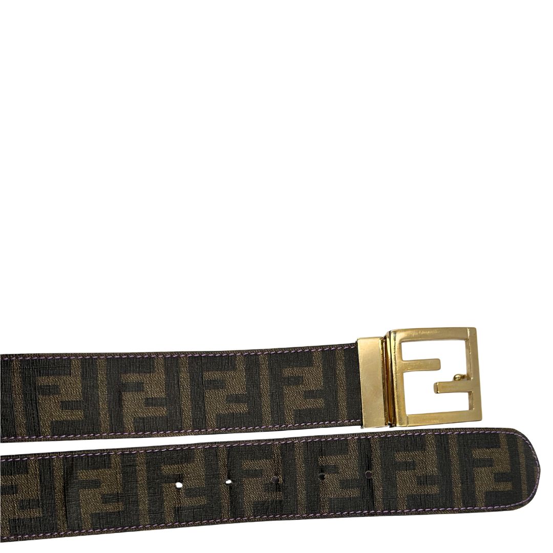 Cintura Fendi reversibile in canvas color tabacco con trama zucca e in pelle viola. Originale, usata, di lusso, in ottime condizioni.