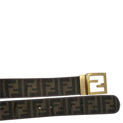 Cintura Fendi reversibile in canvas color tabacco con trama zucca e in pelle viola. Originale, usata, di lusso, in ottime condizioni.