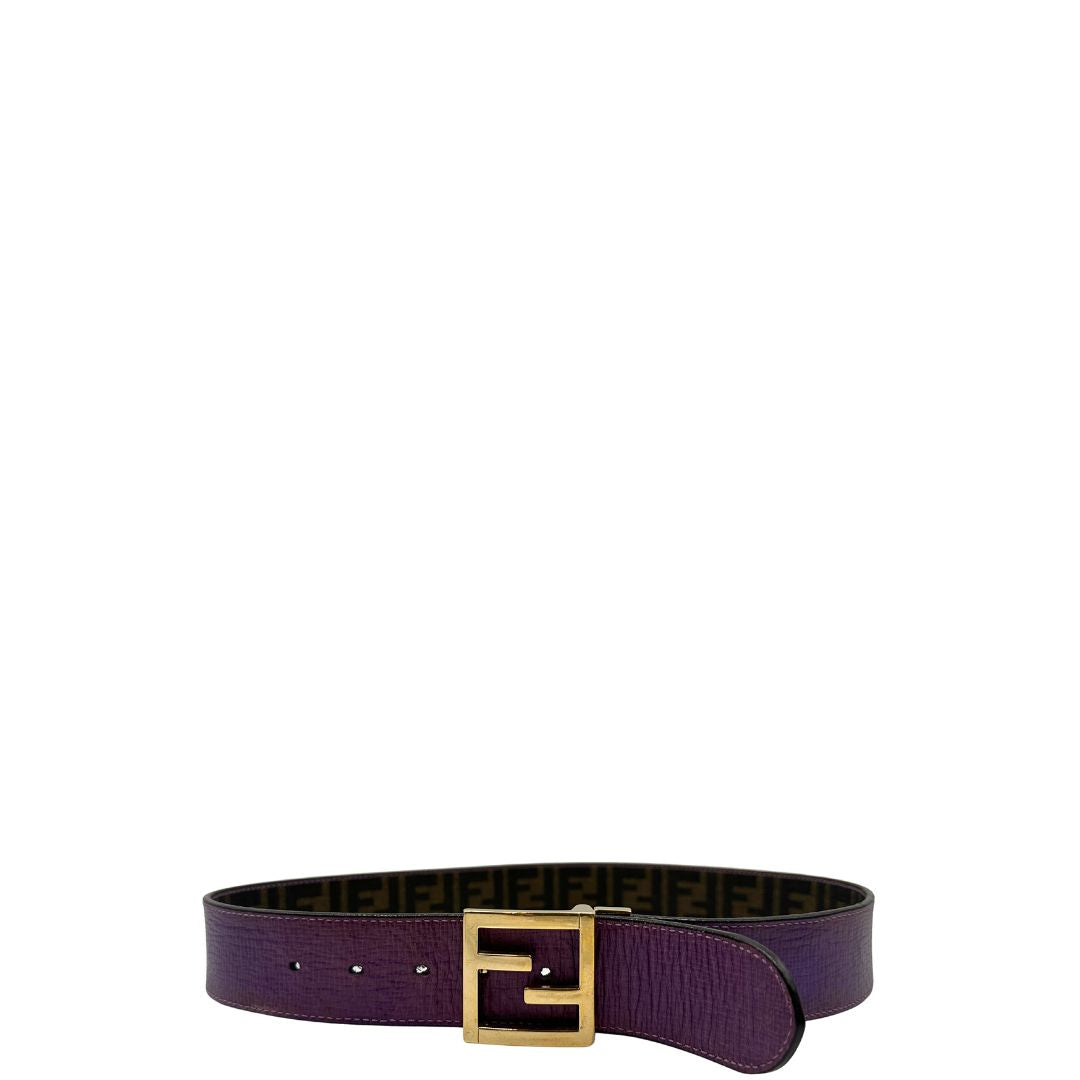 Cintura Fendi reversibile in canvas color tabacco con trama zucca e in pelle viola. Originale, usata, di lusso, in ottime condizioni.