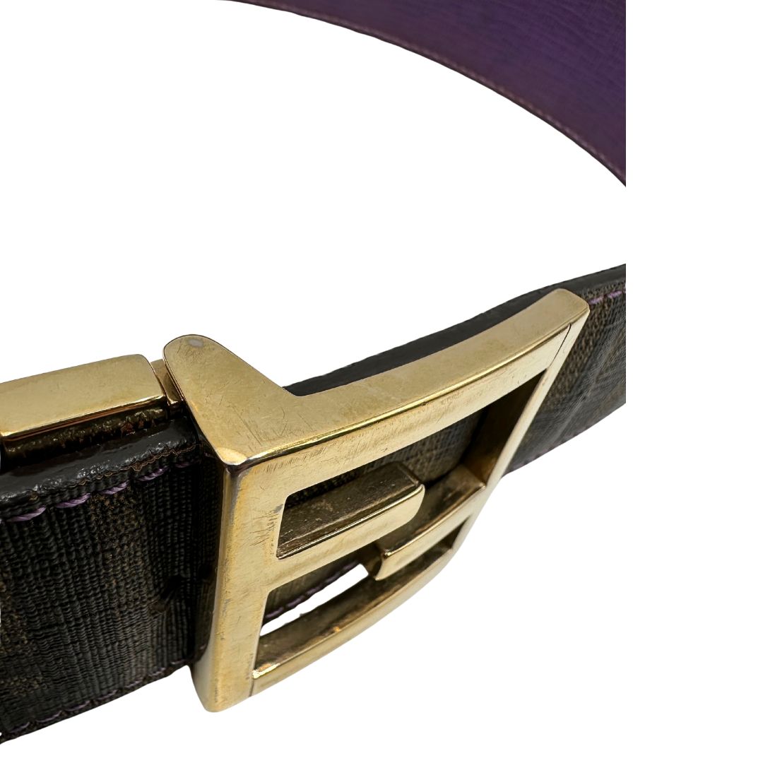 Cintura Fendi reversibile in canvas color tabacco con trama zucca e in pelle viola. Originale, usata, di lusso, in ottime condizioni.