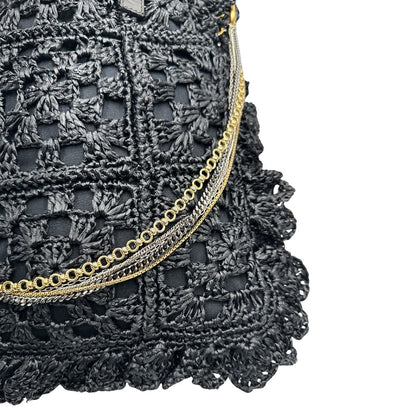 angolo  Borsa Dolce & Gabbana in rafia e pelle nera, dalla struttura morbida e capiente, di lusso, originale, ottime condizioni, usata. 