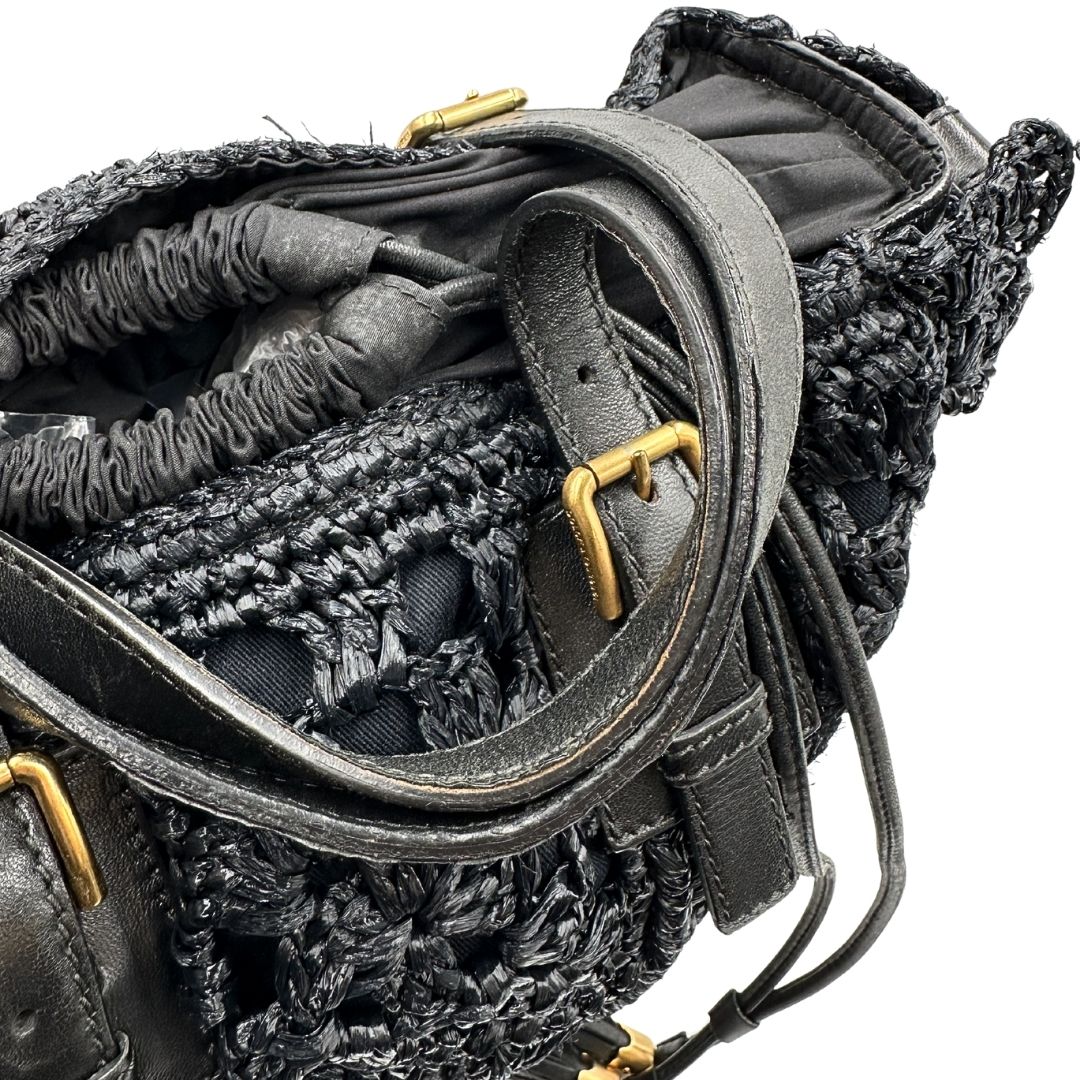manici  Borsa Dolce & Gabbana in rafia e pelle nera, dalla struttura morbida e capiente, di lusso, originale, ottime condizioni, usata. 
