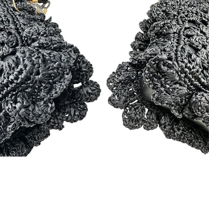 angoli  Borsa Dolce & Gabbana in rafia e pelle nera, dalla struttura morbida e capiente, di lusso, originale, ottime condizioni, usata. 
