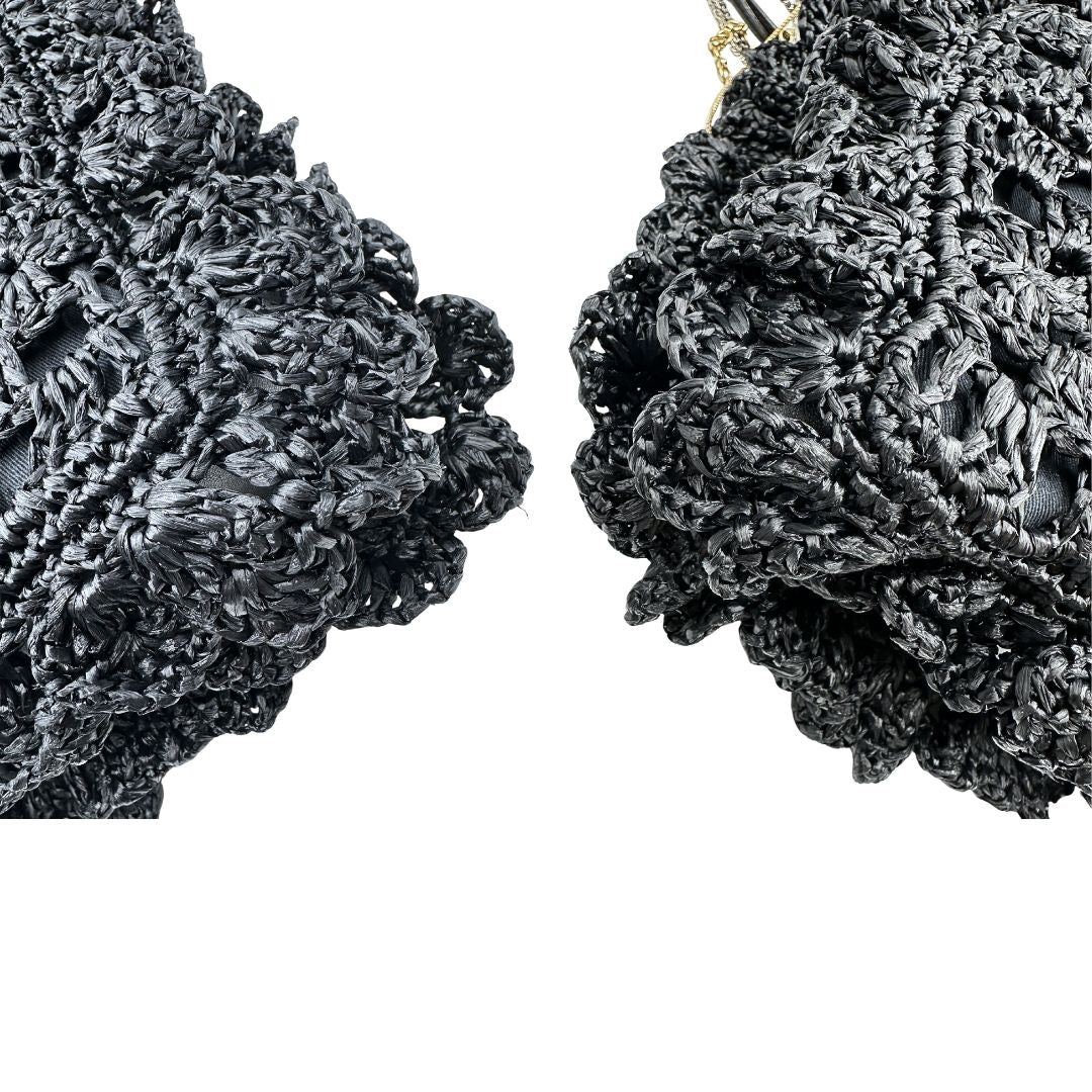 angoli  Borsa Dolce & Gabbana in rafia e pelle nera, dalla struttura morbida e capiente, di lusso, originale, ottime condizioni, usata. 