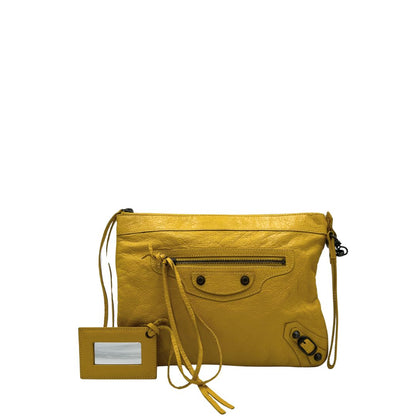 front  Pochette Balenciaga in pelle effetto invecchiato gialla con metalleria color bronzo anticato scuro; munita di un polsino amovibile, da portare a mano, di lusso, originale, ottime condizioni, usata.