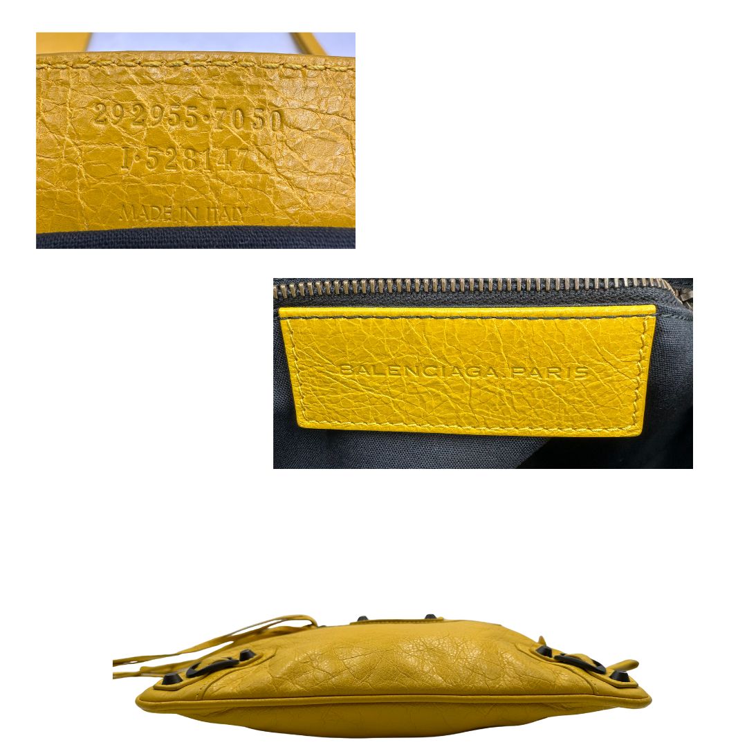 base e codice  Pochette Balenciaga in pelle effetto invecchiato gialla con metalleria color bronzo anticato scuro; munita di un polsino amovibile, da portare a mano, di lusso, originale, ottime condizioni, usata. 