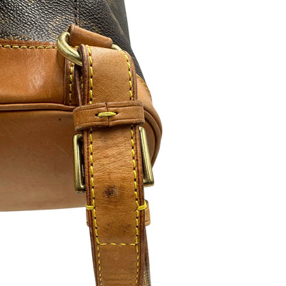 Difetto di uno zaino Montsouris mini in canvas marrone monogram con finiture in vacchetta naturale e parti metalliche dorate, munito di un anello sulla parte superiore e due bretelle in vacchetta regolabili con fibbie. Completo di dustbag.