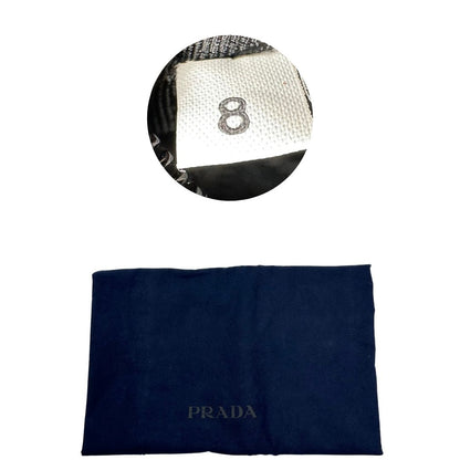 dustbag  Borsone Prada in nylon nero con finiture in pelle tono su tono e parti metalliche argentate; munito di doppi manici stondati e un manico singolo in tessuto, indossabile a spalla o mano. Completo di dustbag e tag porta address, di lusso, originale, ottime condizioni, usata. 