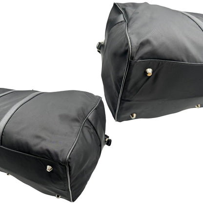 angoli  Borsone Prada in nylon nero con finiture in pelle tono su tono e parti metalliche argentate; munito di doppi manici stondati e un manico singolo in tessuto, indossabile a spalla o mano. Completo di dustbag e tag porta address, di lusso, originale, ottime condizioni, usata. 