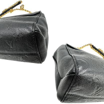 Angoli di una borsa Louis Vuitton in pelle blu notte Monogram Empreinte, con parti metalliche dorate; munita di una tracolla scorrevole con spallacci in pelle. Completa di scatola.