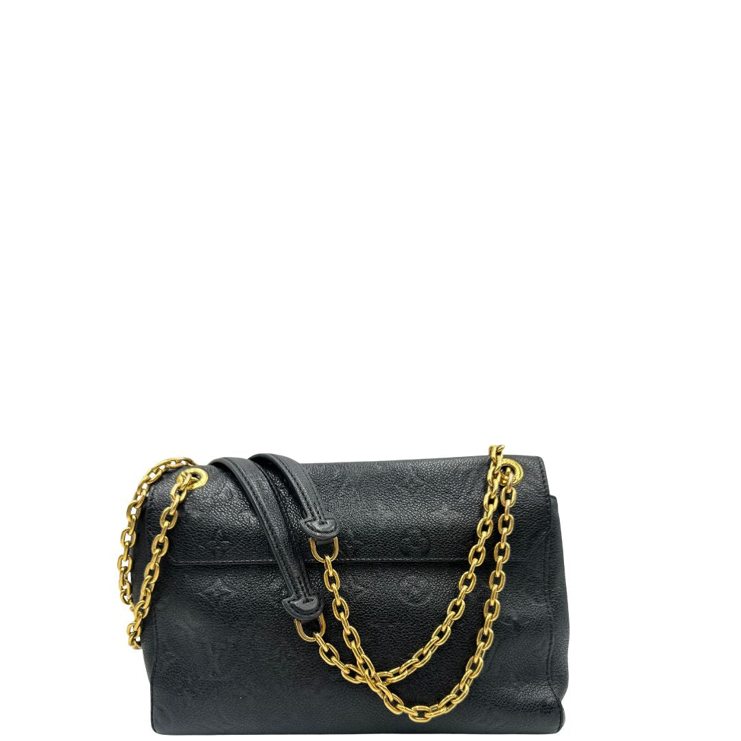 Retro di una borsa Louis Vuitton in pelle blu notte Monogram Empreinte, con parti metalliche dorate; munita di una tracolla scorrevole con spallacci in pelle. Completa di scatola.