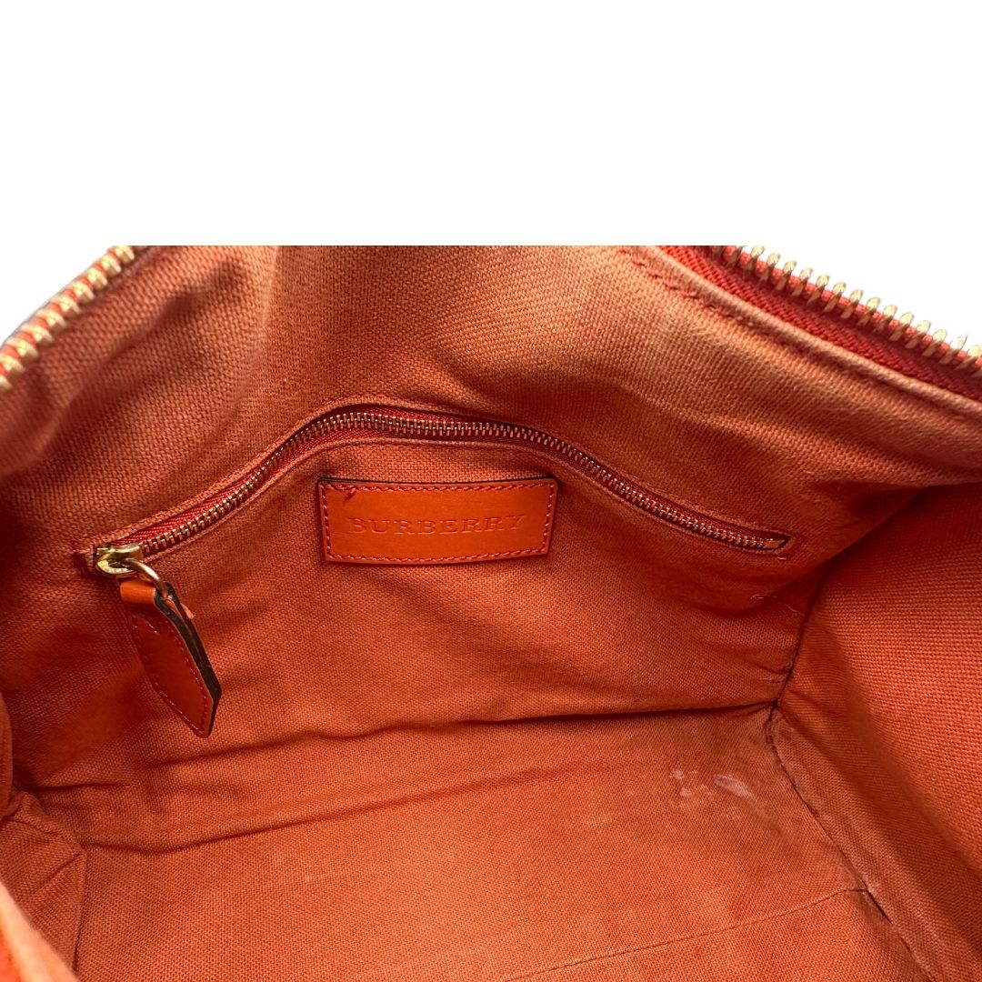 Interno di un bauletto Burberry arancione usato, originale, in ottime condizioni, second hand.