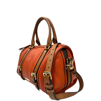 Laterale destro di un bauletto Burberry arancione usato, originale, in ottime condizioni, second hand.